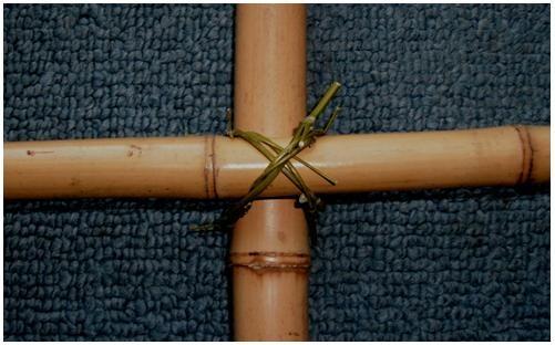 Once you have practiced making these little lashings by themselves, you will be able to make them around a pair of crossed poles.