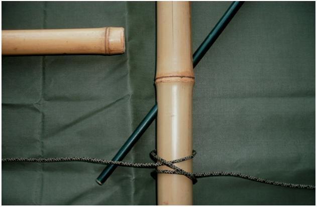 The lashing is made by starting with a clove hitch.