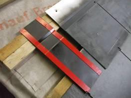 The left side flashing is designed to fit under the side of the PV Slate on the