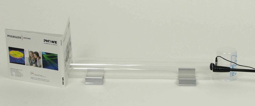 Place the earphone and microphone directly in front of the same opening of the glass tube (Fig. 3).