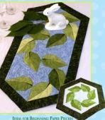 Simply sew a few strips together, trim and sew into pinwheels. Each month we will make a new table runner.