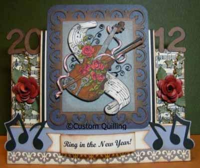 ! A bit of everything from the December kit with an added eyelet, some ribbon in a single punched hole to hang and you have a CAG or would it be a TARD?