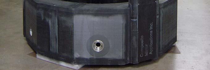 The surfaces were rigidized with a support backing structure resulting in a 0.5 inch thick mirror.
