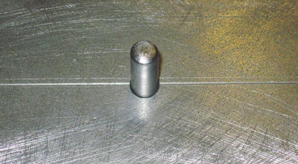 DEPARTMENTS Figure 5: Guide pin threaded into steel beam.