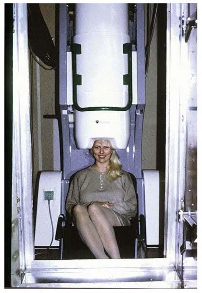 Figure 1. The first whole-head MEG instrument, installed to the Low Temperature Laboratory at HUT. During actual measurements the double doors to the shielded room must be tightly closed.