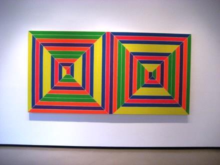 This painting by Frank Stella contains interlocking geometric shapes.