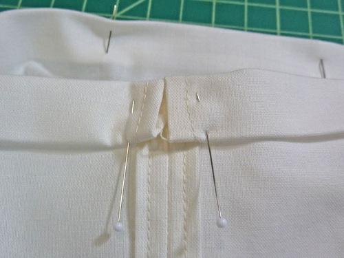 11. Stitch the drawcord channel in place all around, running the seam close to the inner fold.