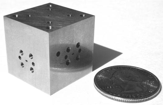 These cause the appearance of a series of narrow resonances regularly spaced in frequency. Fig. 10. View of the four blocks of the OMT. Fig. 8.