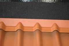 Flash top edge of metal on sidewall with self-adhesive flashing tape making sure to correctly shingle flashing, weather resistant barrier and cladding over metal flashing.