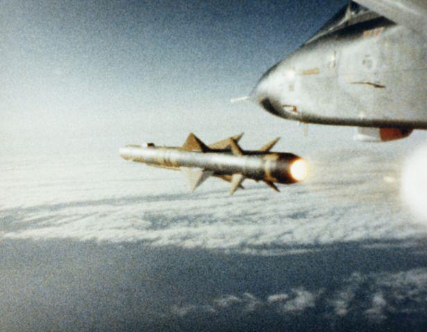 An in-flight view of an AGM-88E AARGM ARM at the moment of launch from an F/A-18D aircraft of USN test squadron VX-31.