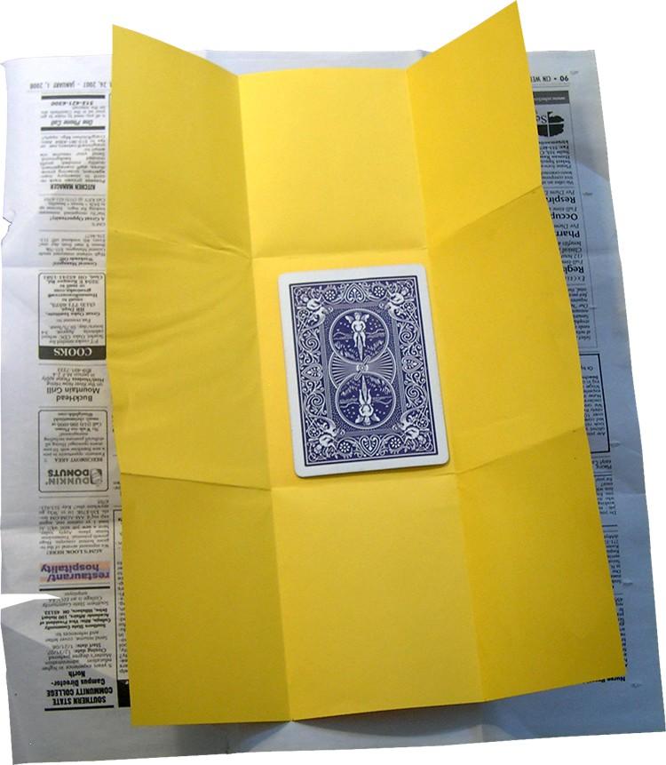 Place the torn pieces in the center of the yellow paper, Have an audience helper tear the card, that will make the trick more interesting.