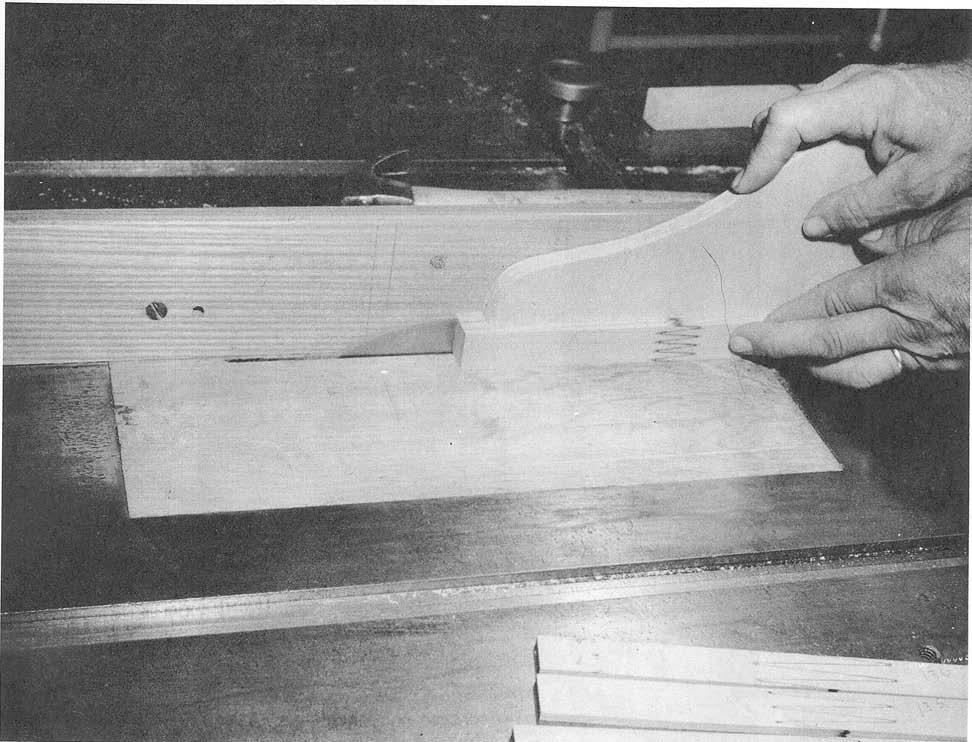the scarf joints were 2-1/2 inches wide and could not be tested without excessive crushing at 30 inches long, necked down on a 17-1/2-inch the grips when the specimens had a thickness radius to a