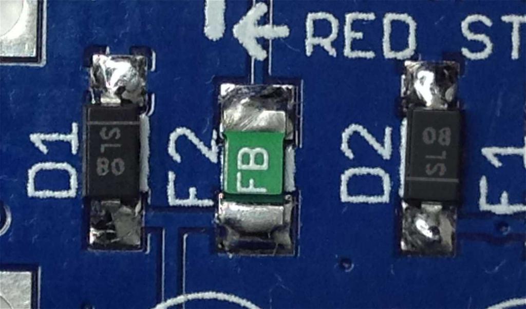 On the PCB, the cathode is indicated by a line in the silk screen adjacent to one of the pads. On this PCB, the cathode for diode D1 points towards the power header, and diode D2 away from the header.