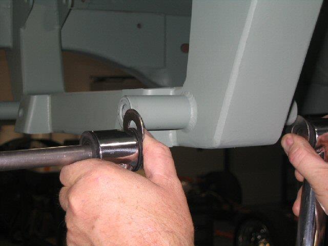 Clamp securely to the bottom of the frame with the wings flush against the inside of the frame and