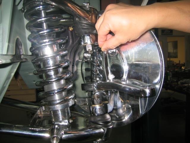 Install AN washer and nut. Tighten and cotter pin. The rack assembly needs to be centered to allow equal steering left to right. On a bench, turn the pinion out to lock one way.