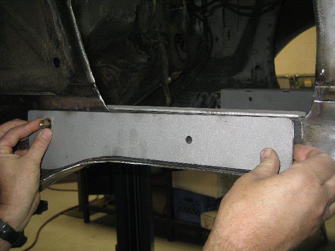 Install the correct outside boxing plate with the bolt and fasten with nut.