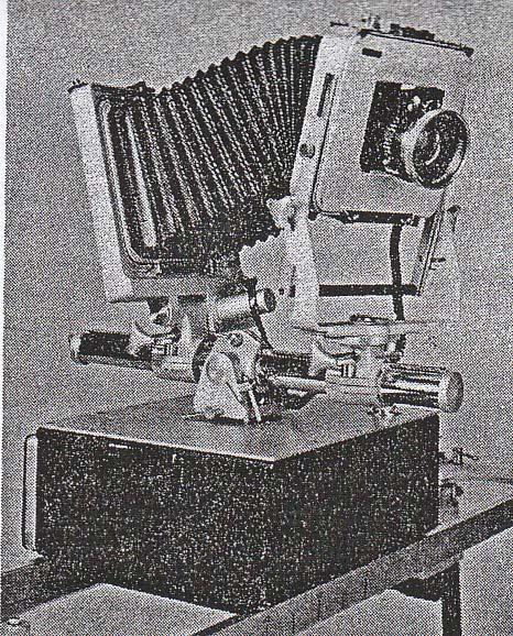 During the exposure, the camera moves from left to right on the rail. The lens assembly is mounted to the camera using a bellows.