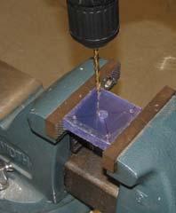 done in the milling machine). Be sure to keep the drill perpendicular to the workpiece to avoid breaking the drill bit.
