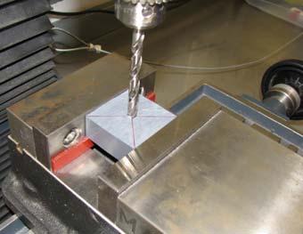 Clamp the block into the milling vise make sure the parallels are supporting the workpiece.