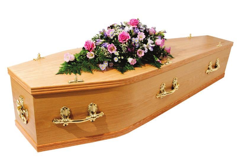 Lewes A light oak veneered coffin with: a satin polished finish three pairs of brass coloured