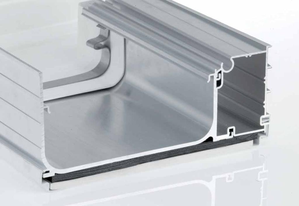 This allows the eaves beam to be mitre cut at corners without requiring any cutting to the box gutter, which can then be cut flush to the outside frame.
