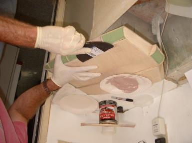 Once the bondo begins to cure, I can easily remove the excess bondo with a putty knife.