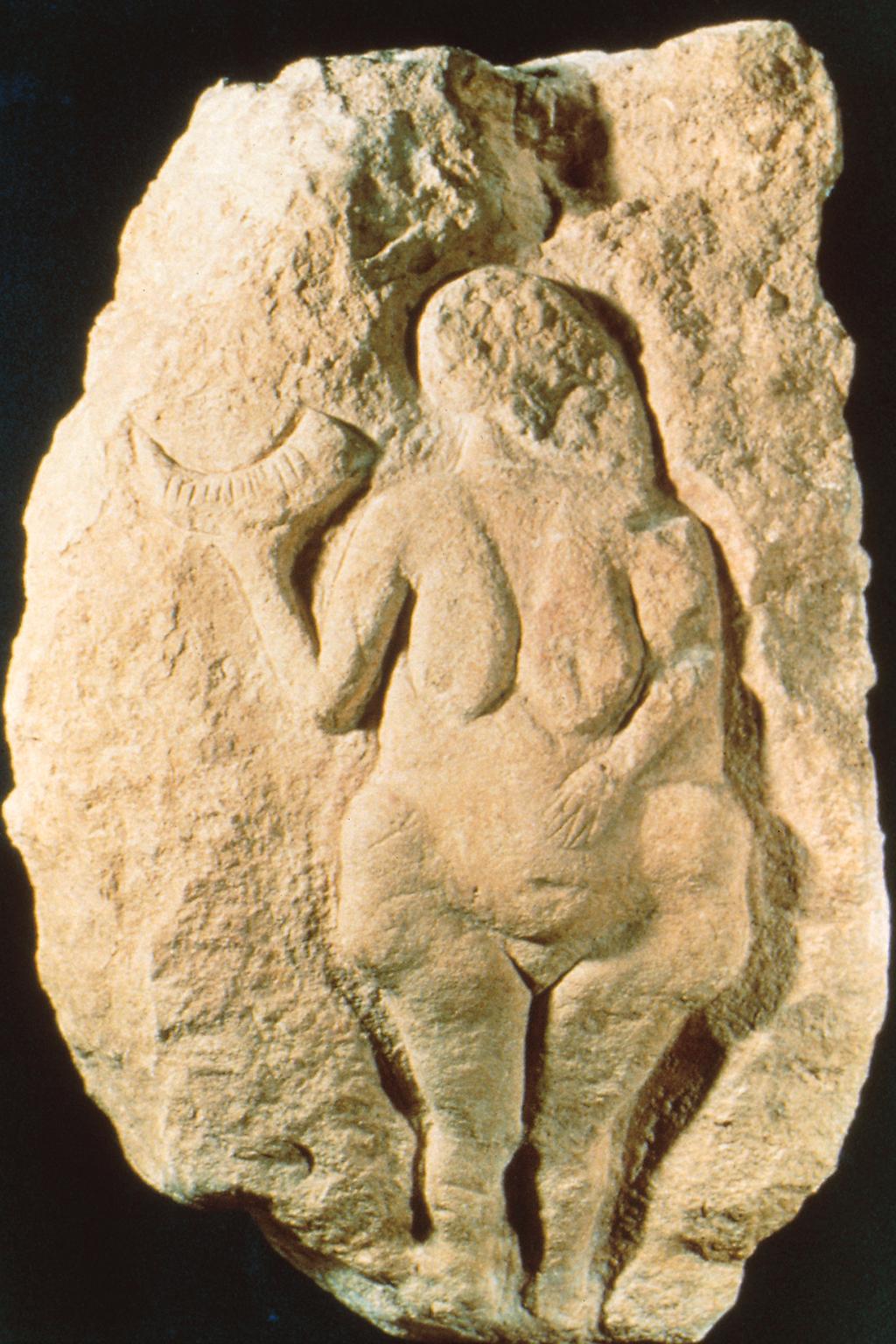 Paleolithic Art Figure 1-5 Woman holding a bison horn, from Laussel, Dordogne, France, ca. 25,000 20,000 BCE. Painted limestone, approx. 1 6 high.