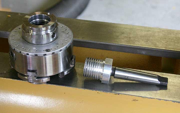on the other side. Oneway also sells a threaded adaptor that fits on their tailstock.