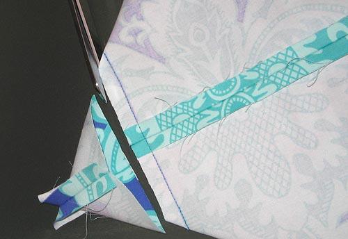 Take the 4" x 4" square of lining fabric and fold it