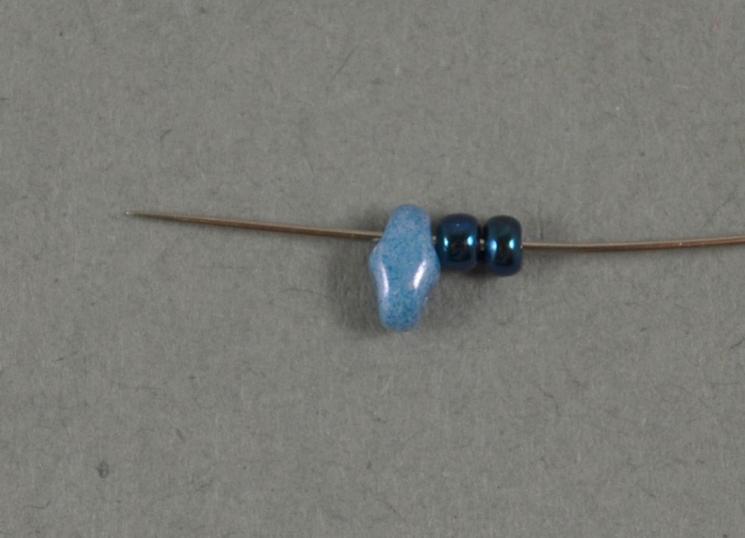 When adding the last 11/0 seed bead take the needle directly through four