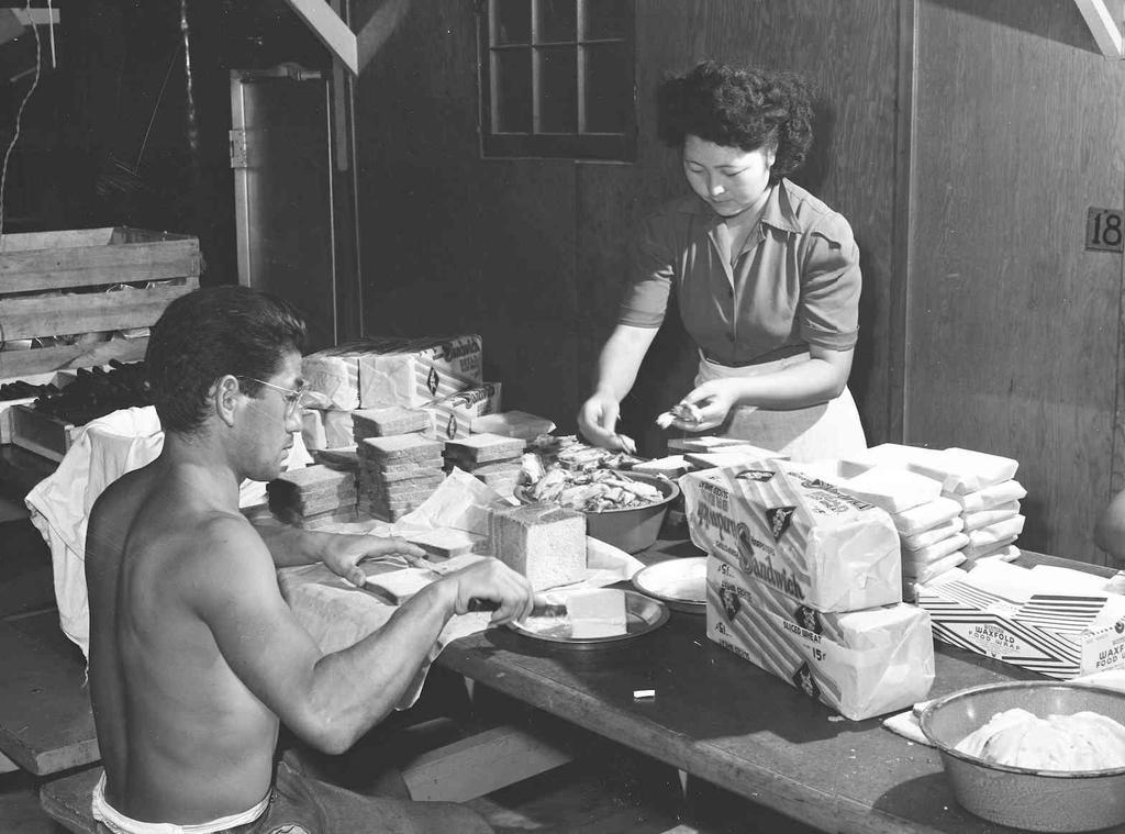 OCHC Lee #029 Making lunch at the camp near Rupert, Idaho. Rupert, Idaho. Civilian Conservation Corps camp now under Farm Security Administration management.