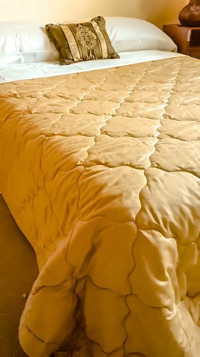 COMFORTERS & BEDSPREADS Comforters QT s comforters can be customized to be reversible and have 100% polyester fiber filling. Available in the same colors as QT s bed sheets.