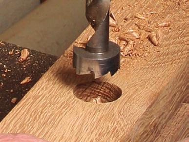 Instead, flip the post and finish from the other side to avoid blowout. Cut the arc after the joinery is finished.