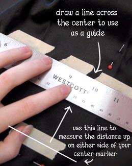 I taped two pieces of tape on either side of your center mark, roughly even with it. Then I measured up that same amount (3 1/4 inches) on either side and drew a line across the center.