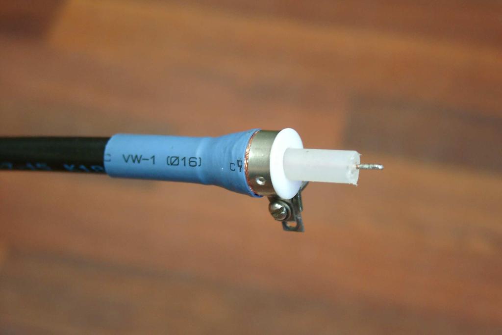 Step 4. Connect the other side of coaxial cable to the load. The cone teflon insulator is used at the cable end to prevent the discharge between central cable wire and the cable braid (See Fig.2).