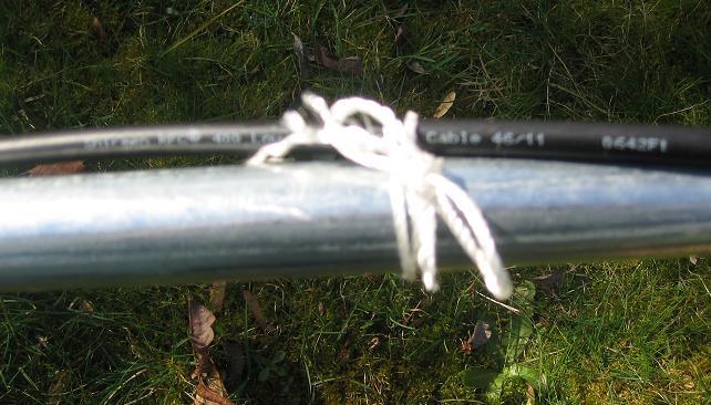 Then in each of the 4 sections of pipe I tied the LMR 400 cable to the pole with a nylon string tied in a bow that will
