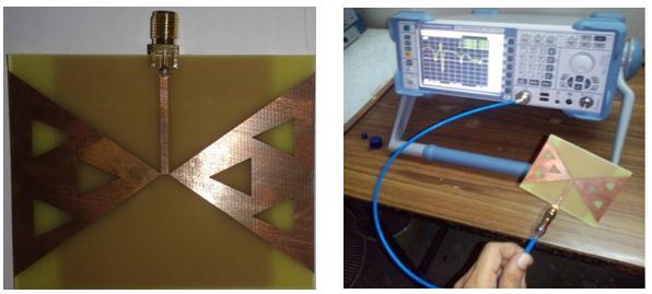 (a)fabricated prototype (b) S 11 measurement setup Figure 4: Photographs of the fabricated antenna and its measurement setup. Figure 5: Return loss characteristic comparison.