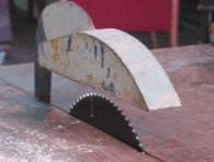 Eliminate the risk of fingers coming into contact with rotating saw blade by fixing a suitable saw guard.