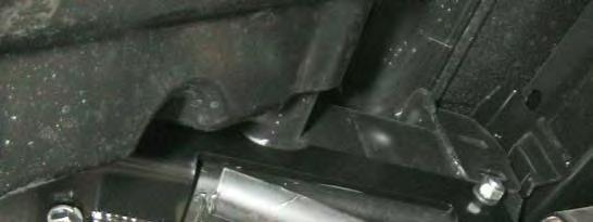 1. Install the frame bracket temporarily on the passenger side frame using the 7/16 x 5 bolt and 7/16