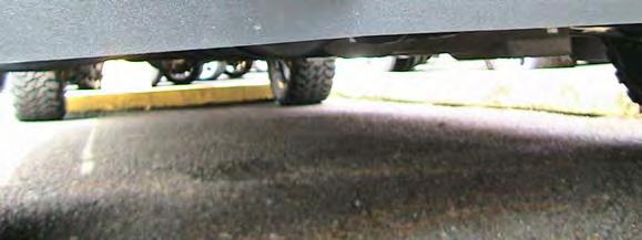 Check the position of the slots by holding the air dam in position centered on the vehicle.
