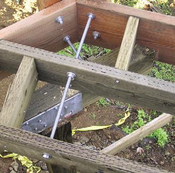 After that, I mark two wood rails to the same length, measured between the posts at decking level.