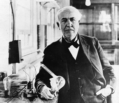 Figure 3: Thomas Edison and his Long Tube Light Bulb In several pictures of Edison holding the light bulb, I noticed a long tube extending from the side.