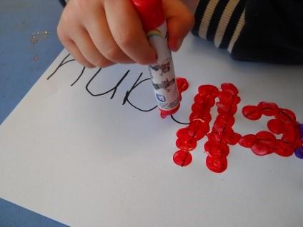 Make a dot at the beginning of the first letter so the children