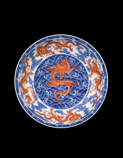 A Magnificent And Rare Iron-Red And Underglaze-Blue Nine Dragon Charger Mark And Period Of Yongzheng Est. HK$30 40 million / US$3.8 5.1 million Diametre re: 47.