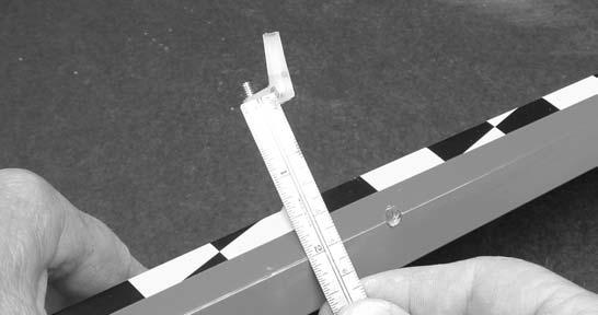 Trial fit the hinges into the holes on both the aileron and wing. If necessary use a 7/32 drill in each hole 1/8 deep to allow the shoulder of the hinge to go in Make sure all hinges insert half way.