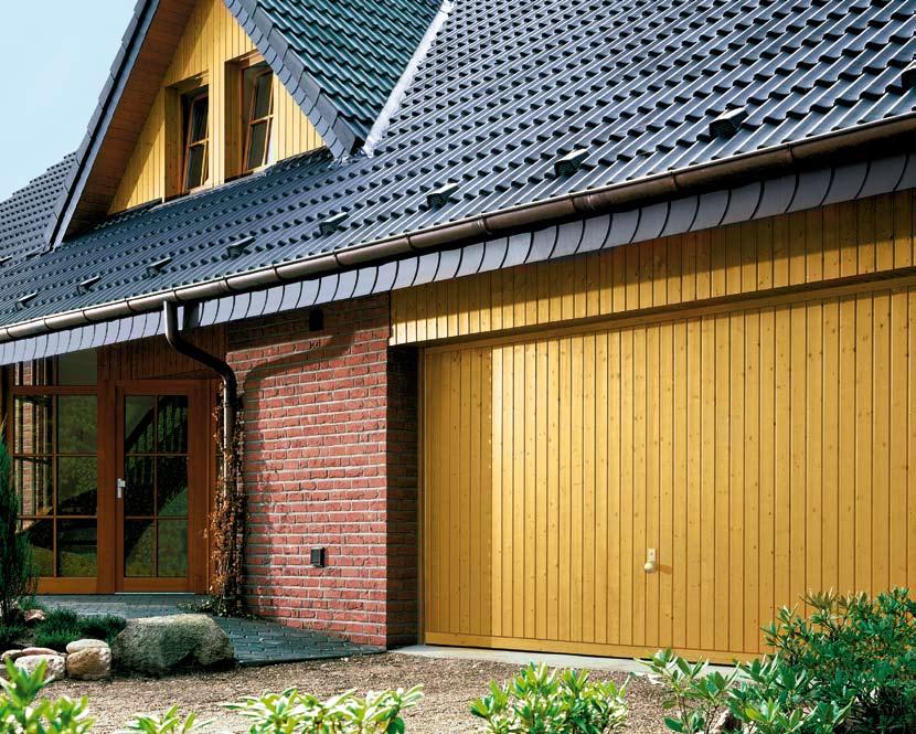 Design 934 Nordic Pine as a double garage door with site-fitted fascia panel, in the style of the gable cladding.