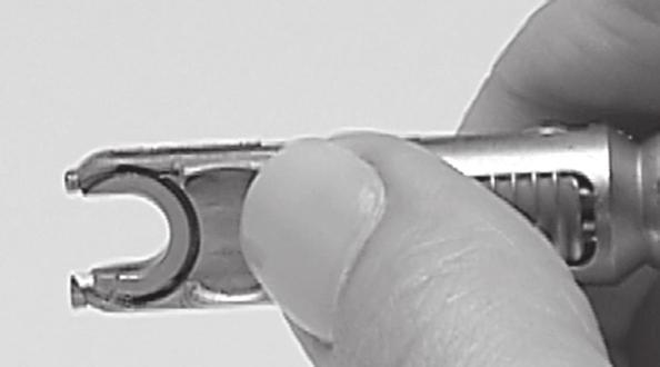 Line up the loading cartridge parallel to the tip of the device and press the tip of the loading