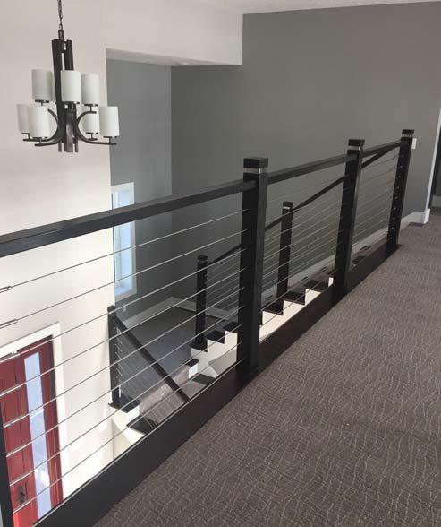 than the big expensive & unsightly turnbuckle styles Photo courtesy of Taylor Made Home Solutions, Ralston, NE Handrail: 6002, Newel: Malta Series 4000-350-SSB Wood Newels min 3.