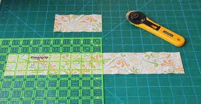 Choice of your favourite applique tools/fusible web, in my case I used "Steam A Seam" fusible web Scrap pieces of batting for trapunto Step 1 - Cutting * First, cut each still folded jelly roll