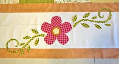 Cut out your applique shapes and arrange them in a pleasing manner before ironing them down: Spread out the little flowers in intersections over